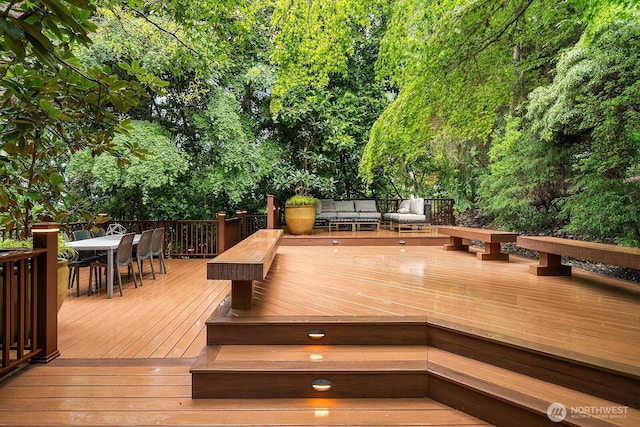 wooden terrace featuring an outdoor living space