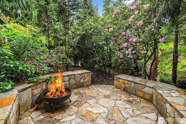 view of patio / terrace with an outdoor fire pit