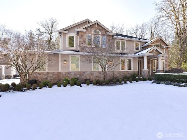 craftsman-style house with stone siding