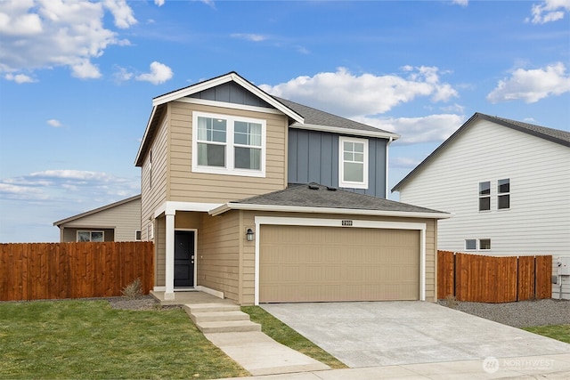 view of front of house featuring fence, concrete driveway, a front lawn, a garage, and board and batten siding