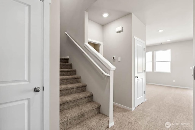 stairway featuring recessed lighting, baseboards, and carpet floors