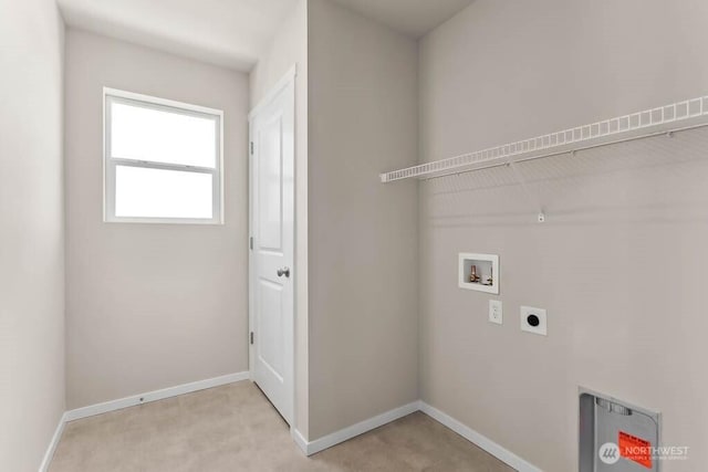 washroom with baseboards, hookup for an electric dryer, washer hookup, and laundry area