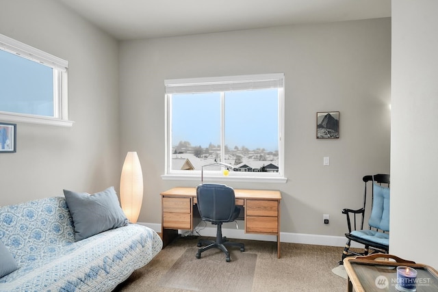 carpeted office featuring baseboards