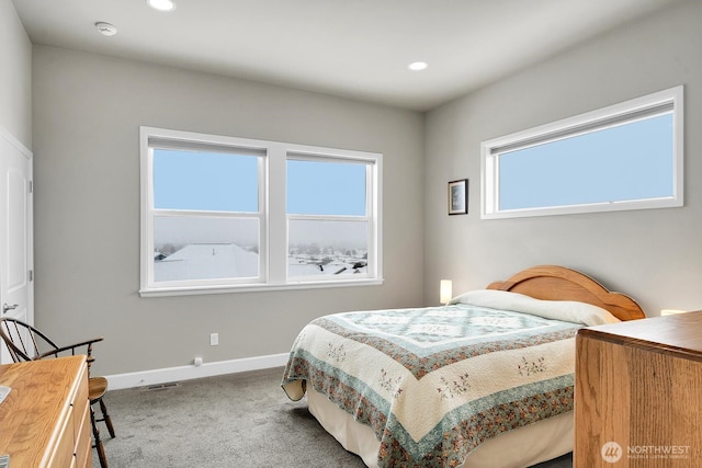 carpeted bedroom with visible vents, baseboards, and recessed lighting