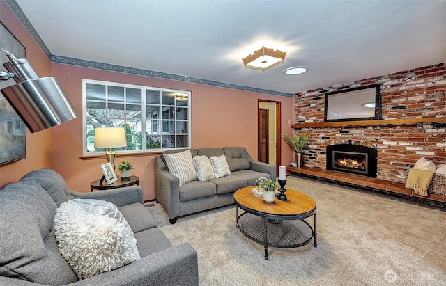 living area featuring a brick fireplace and light colored carpet