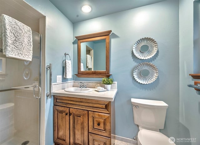 full bathroom with toilet, a shower stall, and vanity