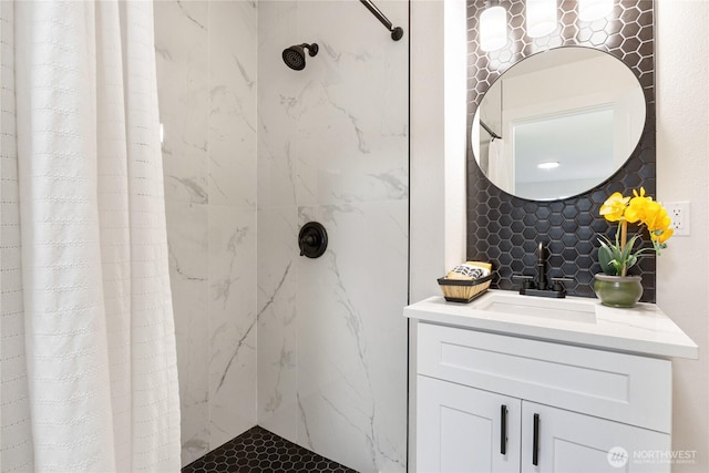 full bathroom featuring a shower stall and vanity