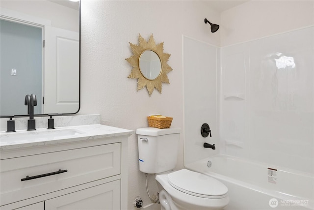 bathroom featuring shower / bathing tub combination, vanity, and toilet