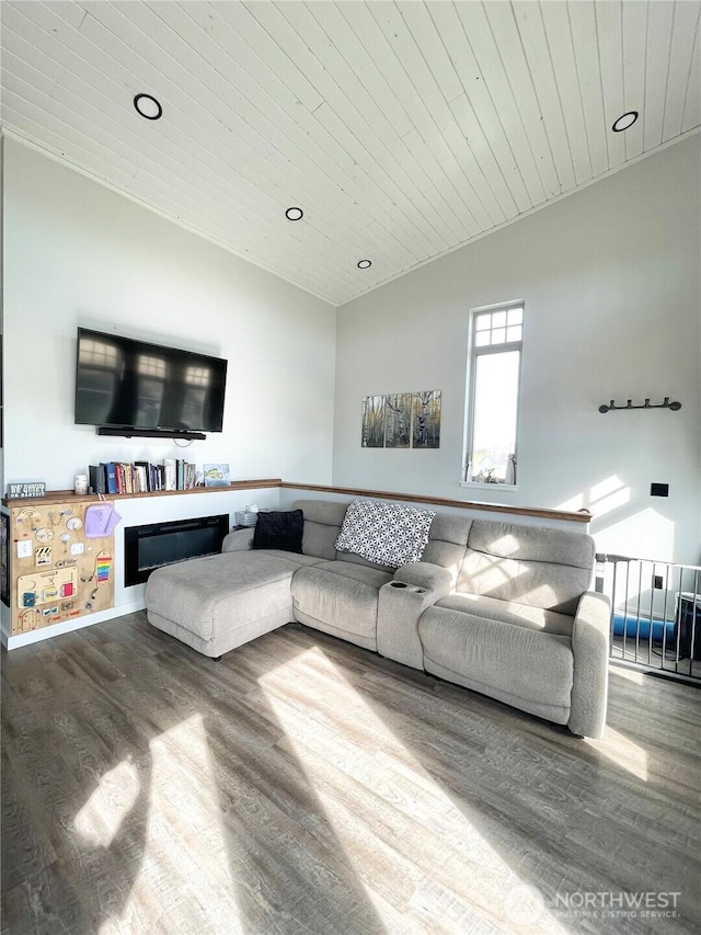 living area with lofted ceiling, wooden ceiling, wood finished floors, and recessed lighting