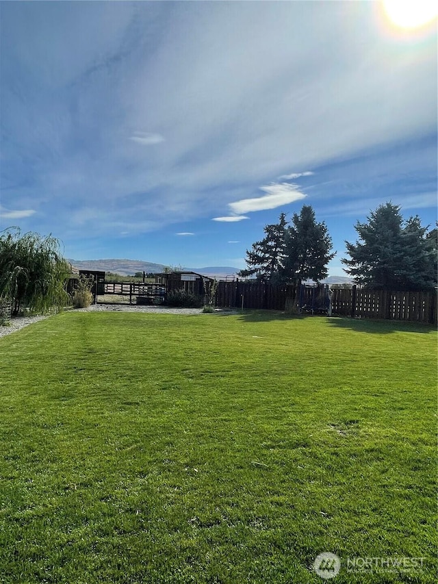 view of yard featuring fence