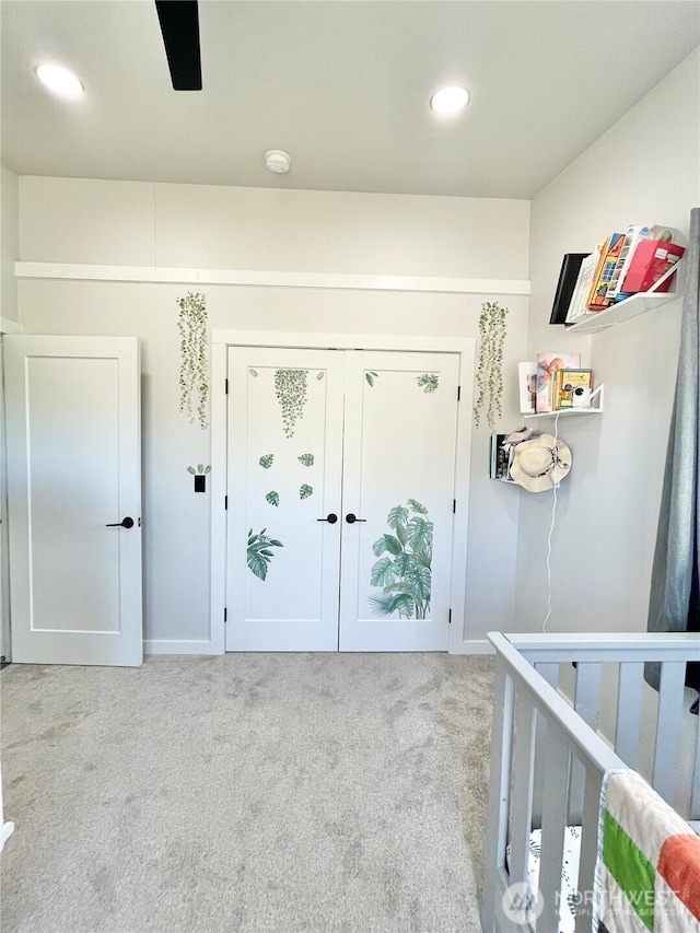 carpeted entryway with recessed lighting