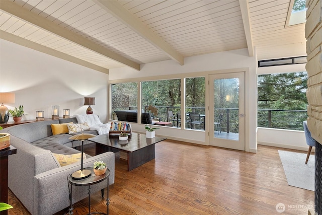 living room with vaulted ceiling with beams, wood ceiling, baseboards, and wood finished floors