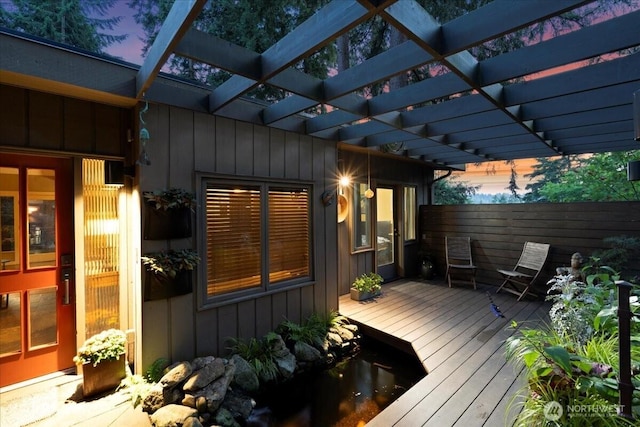 deck with fence and a pergola