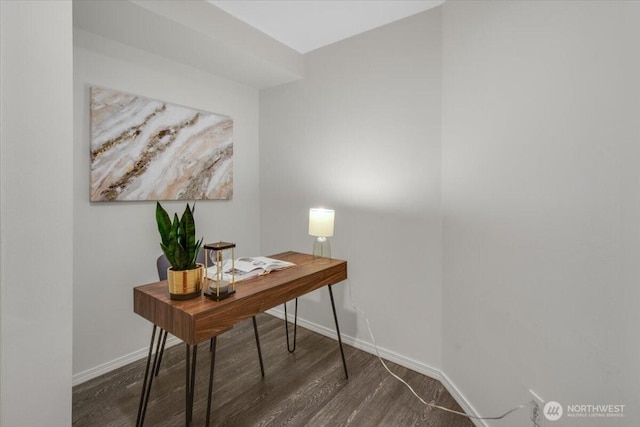 home office featuring baseboards and wood finished floors