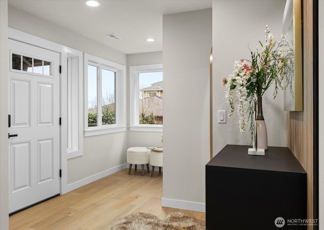 foyer entrance with light wood-type flooring