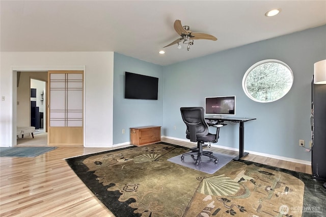office space with a ceiling fan, baseboards, recessed lighting, and wood finished floors