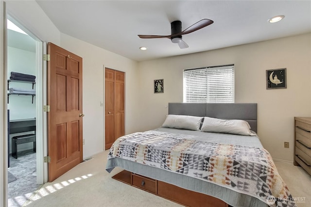 bedroom featuring a ceiling fan, light carpet, a closet, and recessed lighting