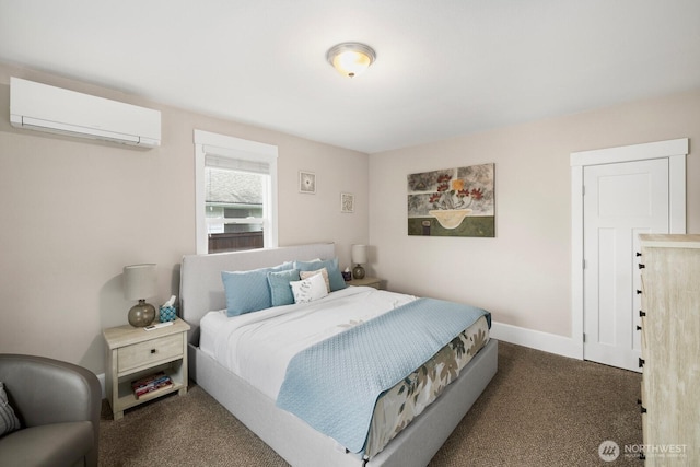 bedroom featuring a wall unit AC, dark carpet, and baseboards