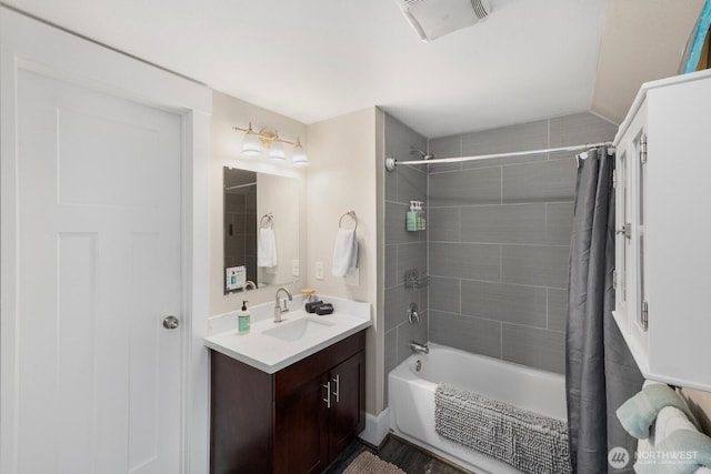 full bath featuring vanity and shower / bathtub combination with curtain