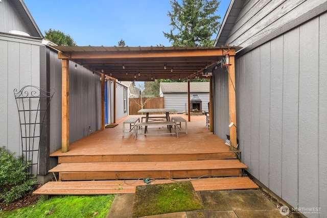 wooden deck featuring outdoor dining space