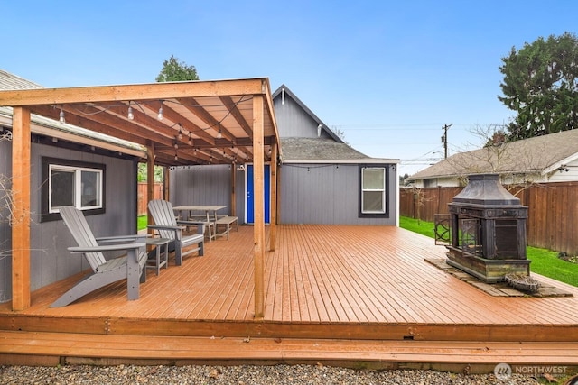 wooden deck with fence and a pergola