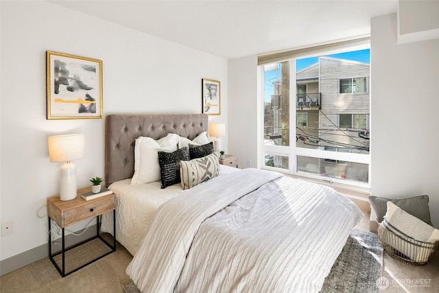 carpeted bedroom with baseboards