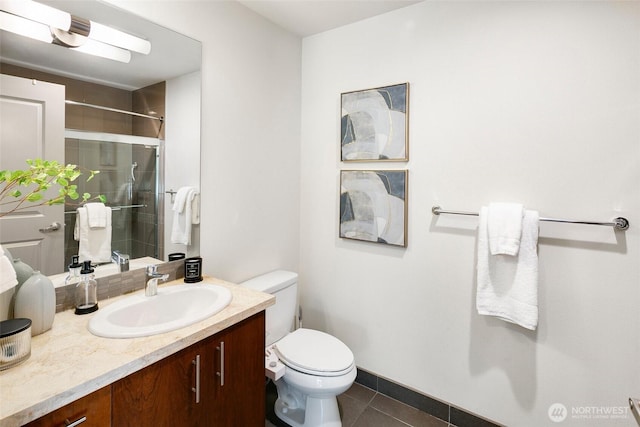 full bathroom with toilet, a shower with door, vanity, and tile patterned floors