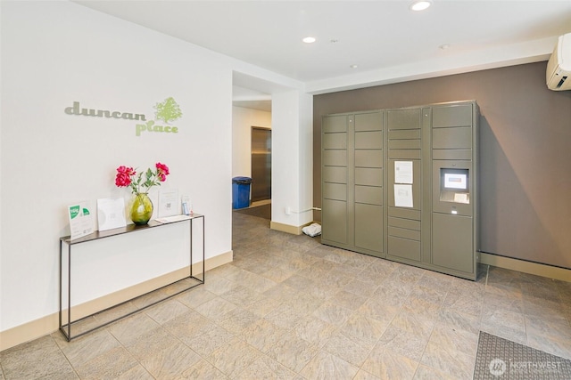 foyer entrance featuring recessed lighting, a wall unit AC, and baseboards