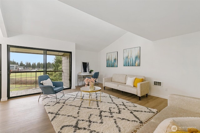 living room with visible vents, baseboards, vaulted ceiling, and wood finished floors