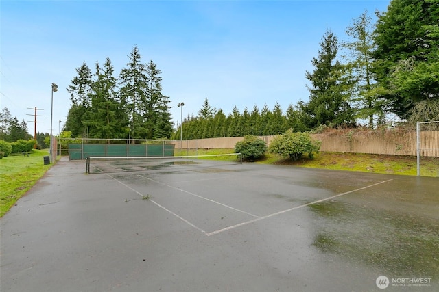 view of tennis court with fence