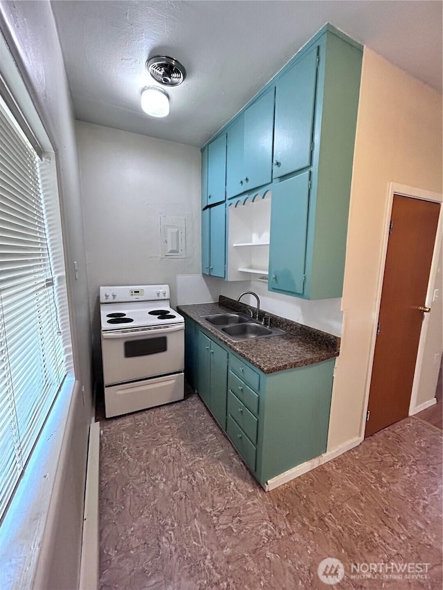 kitchen with sink, white electric stove, and a textured ceiling
