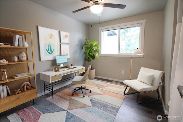 office space with dark hardwood / wood-style floors and ceiling fan