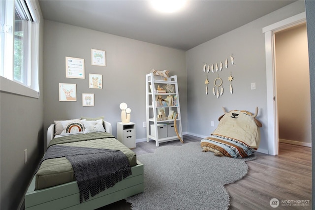 bedroom with hardwood / wood-style floors