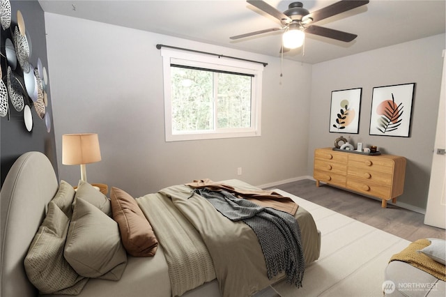 bedroom featuring light hardwood / wood-style flooring and ceiling fan