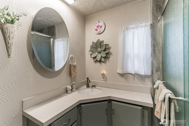 bathroom with vanity and a textured ceiling