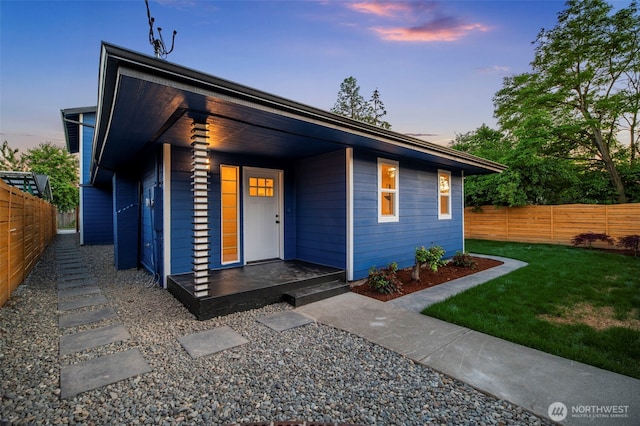 view of front of home with a yard