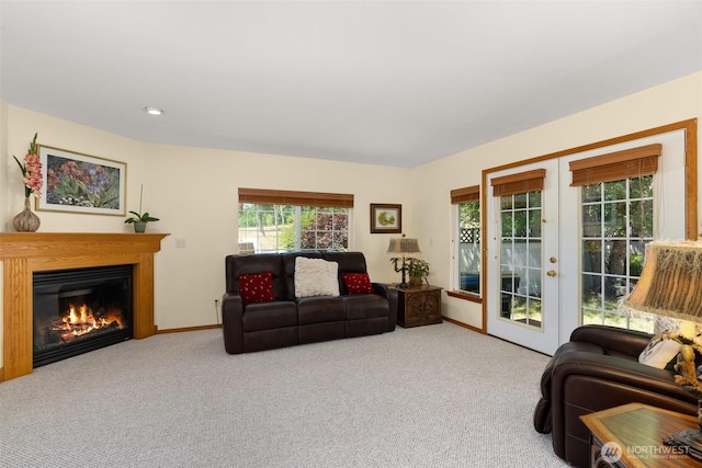 carpeted living room featuring french doors