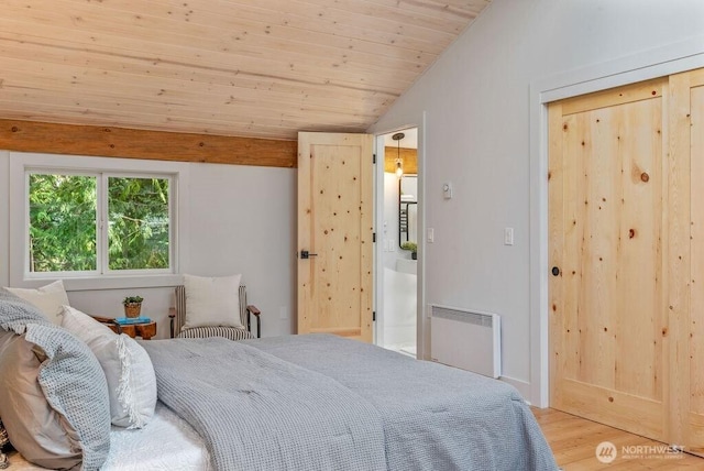 bedroom with lofted ceiling, wooden ceiling, radiator heating unit, and wood finished floors