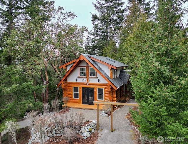 cabin with log exterior