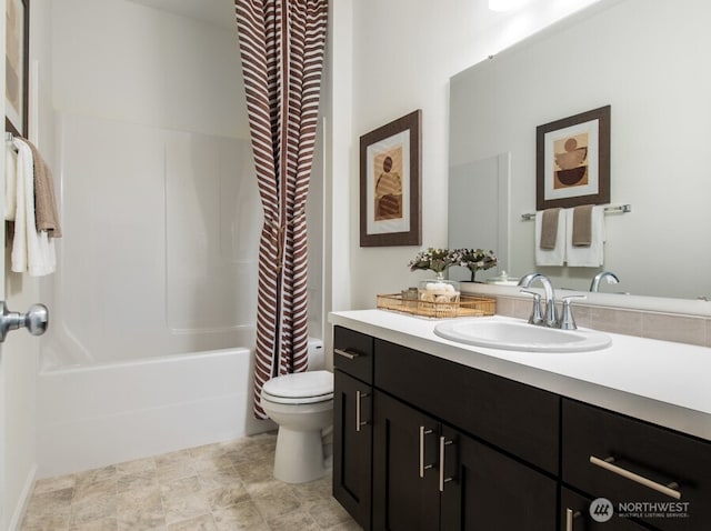 full bathroom with shower / bathtub combination with curtain, vanity, and toilet