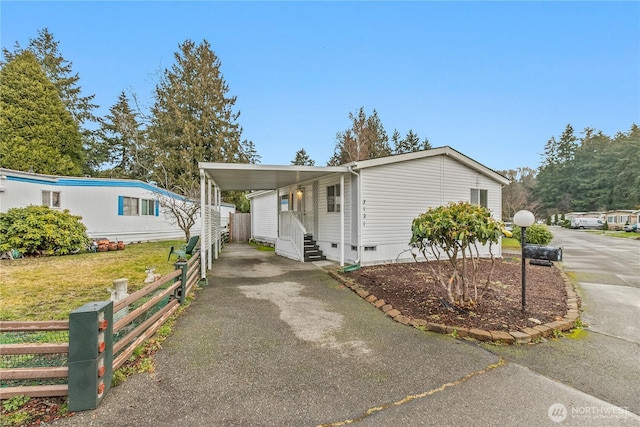 manufactured / mobile home featuring a carport