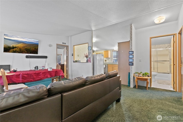 living room with lofted ceiling and carpet flooring