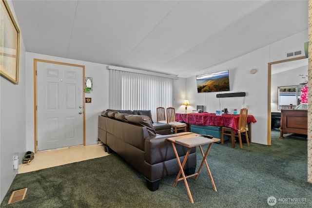 living room with dark colored carpet