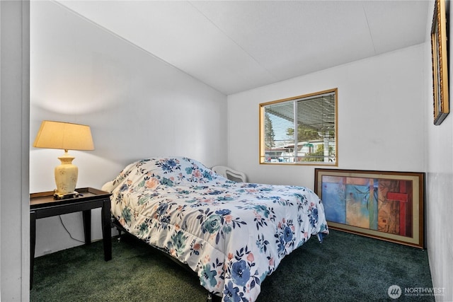 carpeted bedroom with vaulted ceiling