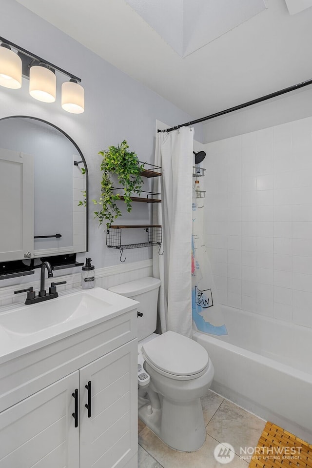 full bathroom with vanity, shower / tub combo with curtain, and toilet