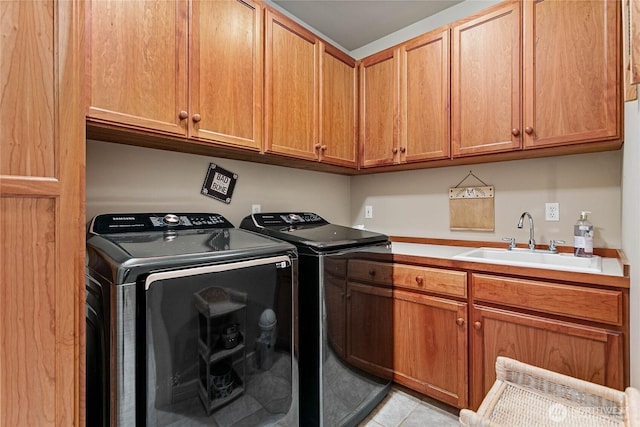 laundry room with independent washer and dryer, cabinet space, a sink, and light tile patterned flooring