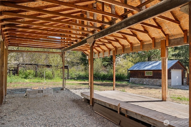 view of patio / terrace with a garage and an outdoor structure