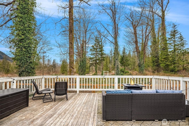 wooden deck featuring an outdoor living space