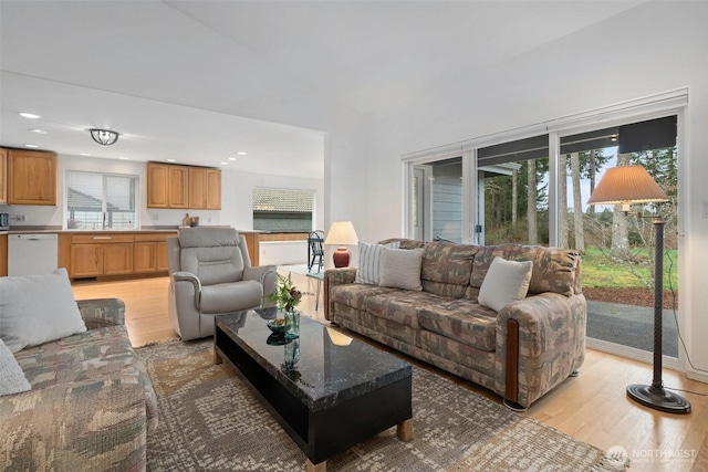 living area featuring recessed lighting and light wood-type flooring