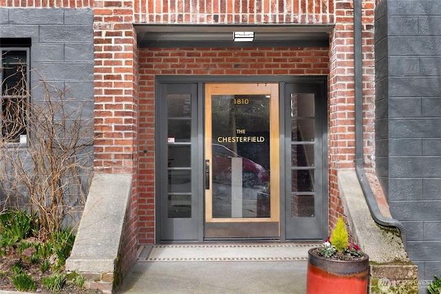 entrance to property with brick siding